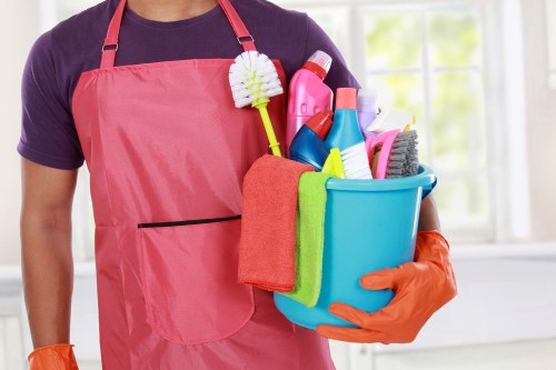 Chelsea Cleaners staff using protective equipment during a safe cleaning task