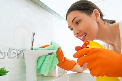 Local cleaner working in a Chelsea apartment with careful attention to detail