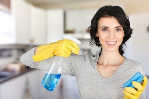Cleaner preparing a Chelsea office for daily business use